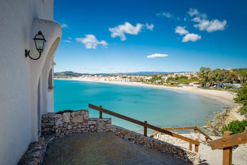 a view of the beach from a building at Hotel Yola in Altafulla