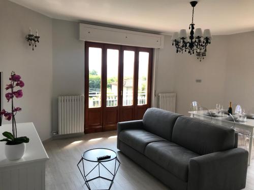 a living room with a couch and a table at Villa Sofia in Baveno