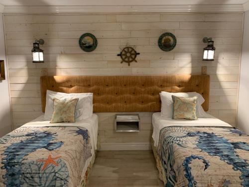 two beds in a room with two at RAIROYALE AT SAND CASTLES in Ocho Rios