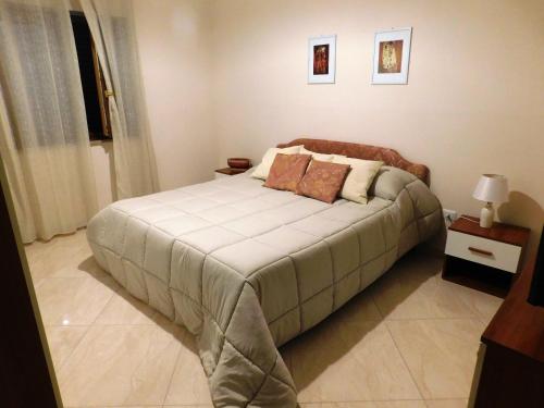a bedroom with a large bed in a room at Casa del Principe in Ottaviano