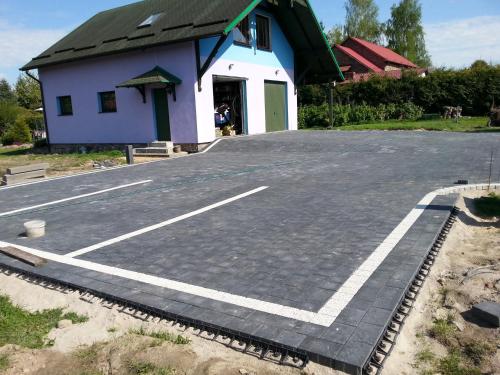 a parking lot in front of a building at Pod Sową in Drawsko Pomorskie