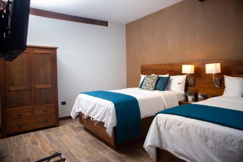 Voodi või voodid majutusasutuse Casa Villamil Boutique Hotel toas
