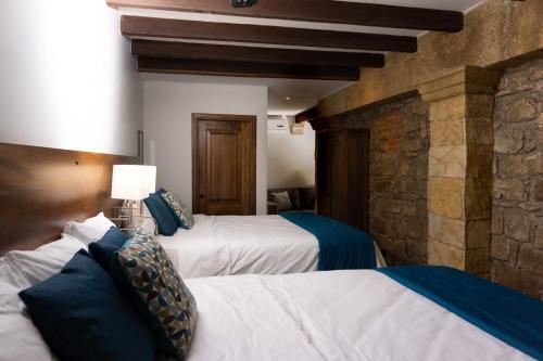 Ένα ή περισσότερα κρεβάτια σε δωμάτιο στο Casa Villamil Boutique Hotel