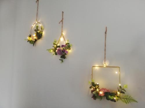 a heart shaped mirror with flowers and lights at Landmark By Katana 4BR Romantic Seaview Homestay Gurney无敌海景四房套房 in Tanjong Tokong
