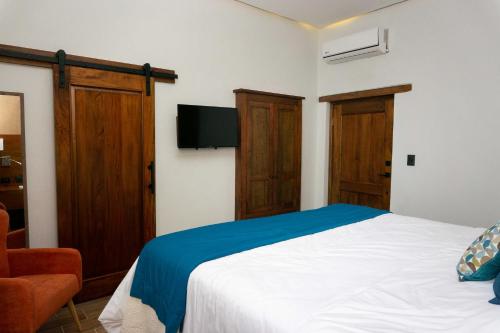 Voodi või voodid majutusasutuse Casa Villamil Boutique Hotel toas