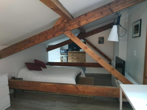a bedroom with a bed in the attic at Attic one bedroom flat in Old Town Lyon in Lyon