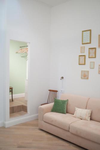 a living room with a couch and a chair at L'Alighieri in Monterotondo