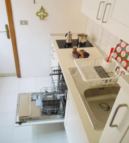 a kitchen with a dish washer and a sink at Florence Center Duomo in Florence