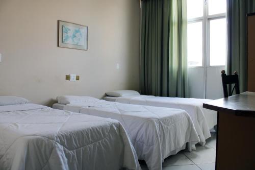 Voodi või voodid majutusasutuse Realminas Hotel e Restaurante toas