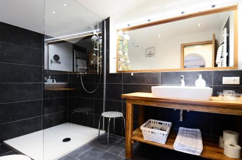 a bathroom with a sink and a mirror at Schörghof in Abtenau