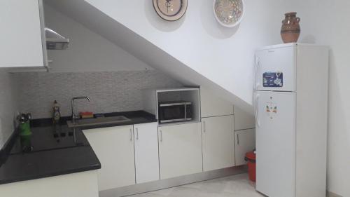 Kuchyň nebo kuchyňský kout v ubytování Appartement à La Marsa