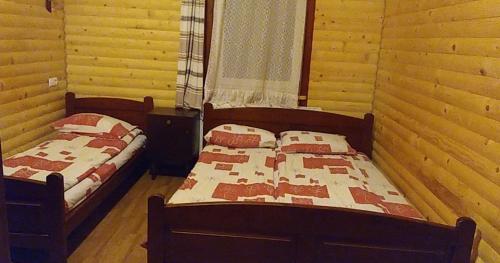 Postel nebo postele na pokoji v ubytování Дім з видом на гори.
