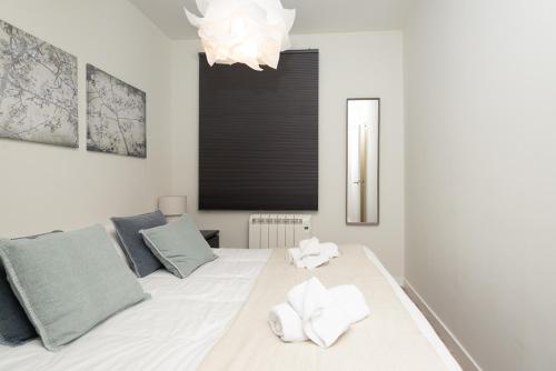 Postel nebo postele na pokoji v ubytování Apartamentos Mikka Mundial