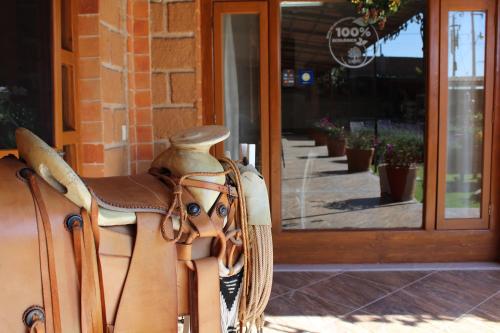 a horse head bag sitting in front of a store at Hotel Boutique La Herencia in Tequisquiapan