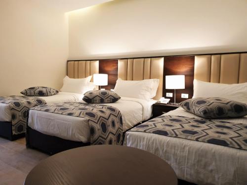 Ένα ή περισσότερα κρεβάτια σε δωμάτιο στο Petra Heart Hotel