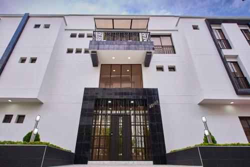 a building with a gate in front of it at Casa Esmeralda Hotel Boutique in Cali
