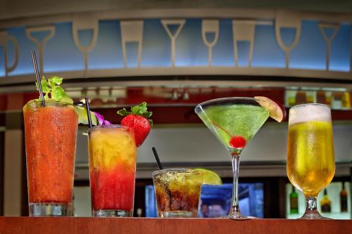 a group of four cocktails sitting on a table at Holiday Inn Jacksonville E 295 Baymeadows by IHG in Jacksonville