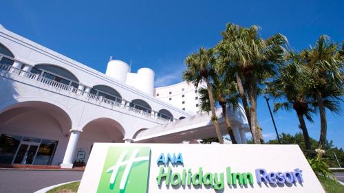 a sign in front of a building with a holiday inn resort at ANA Holiday Inn Resort Miyazaki by IHG in Miyazaki