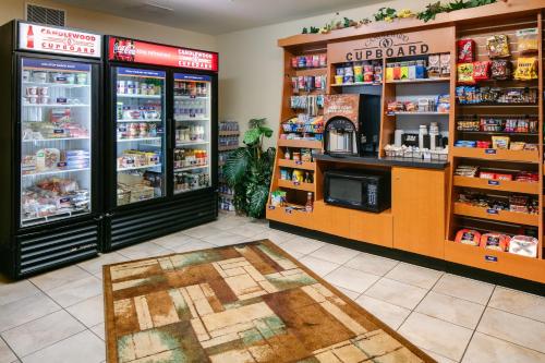 a store with two refrigerators in a grocery store at Candlewood Suites La Crosse by IHG in La Crosse