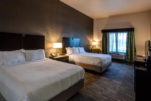 a hotel room with two beds and a window at Holiday Inn Express & Suites Gatesville - N. Ft Hood by IHG in Gatesville