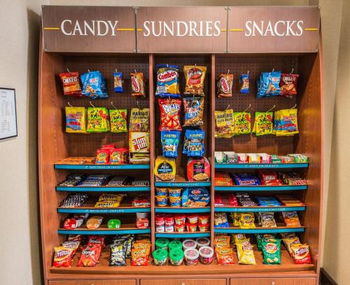 a refrigerator filled with lots of different types of food at Staybridge Suites Wilmington East by IHG in Wilmington