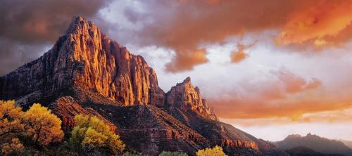 a mountain with autumn trees in front of it at Holiday Inn Express & Suites Kanab by IHG in Kanab