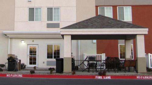 a house with a gazebo in front of it at Candlewood Suites Midland by IHG in Midland