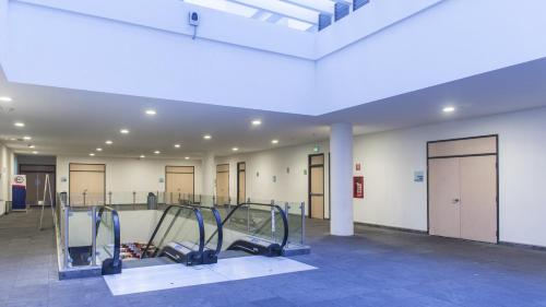 a gym with treadmills and machines in a building at Holiday Inn Express Xalapa by IHG in Xalapa