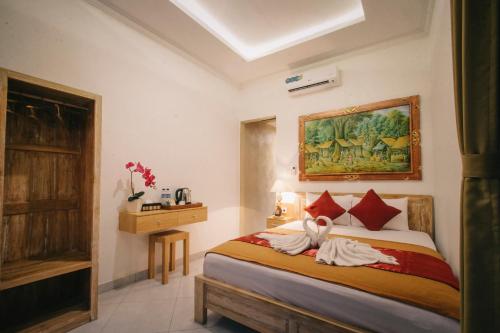 Tempat tidur dalam kamar di D'Ubud House
