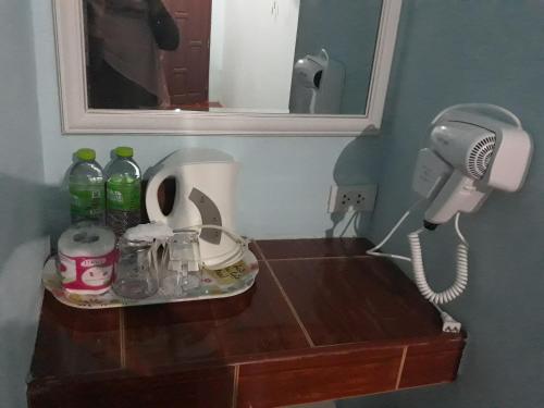 a table with a phone and a counter top at New Andaman Bay Bungalow in Ko Lanta
