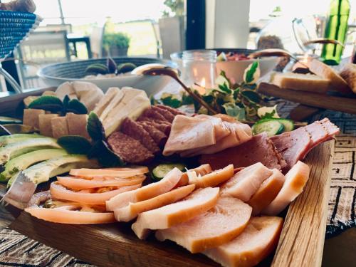 a plate of food with meat and vegetables on a table at Marianne Wine Estate in Stellenbosch