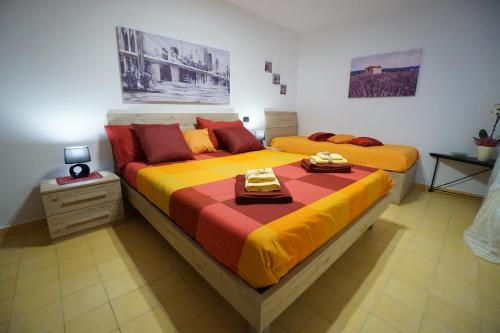 A bed or beds in a room at Aretè Apartments