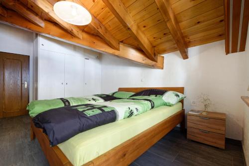 Krevet ili kreveti u jedinici u okviru objekta Appartement au centre de Zermatt (4-8 personnes)