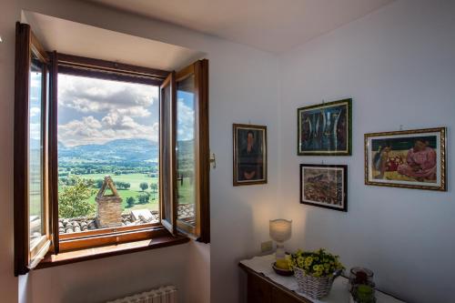 a room with a window with a view at Perla in Spello