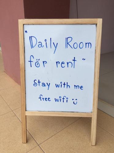 a sign that says daily room for rent stay with me free wifi at Connexion in Ko Yao Noi