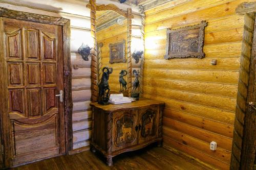 a room with a door and a wooden wall at ООО РГК Русская охота in Penza