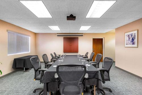 a conference room with a long table and chairs at Baymont by Wyndham Des Moines Airport in Des Moines