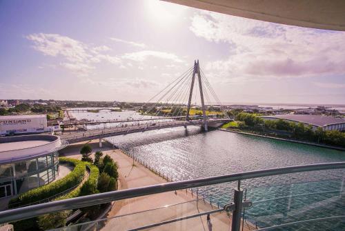 a bridge over a river in a city at Waterfront Southport Hotel in Southport