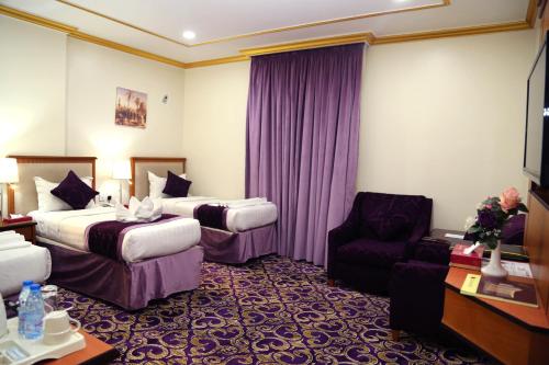 Postel nebo postele na pokoji v ubytování Amjad Al Deafah Hotel
