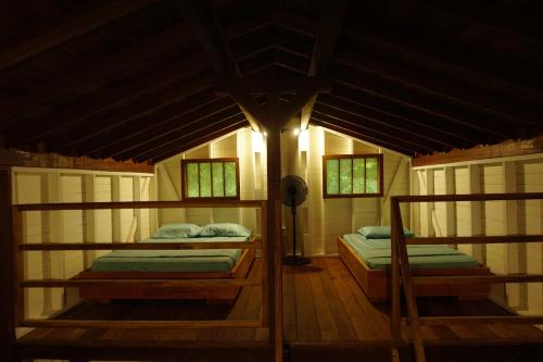 Postel nebo postele na pokoji v ubytování La tarima del colibri Ecolodge