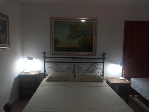 A bed or beds in a room at Residence degli ulivi