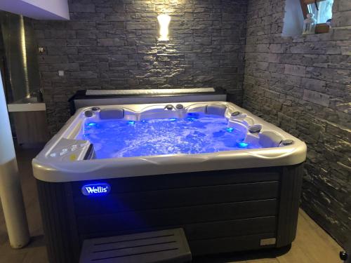 a jacuzzi tub in a room at Slanický Dvor in Námestovo