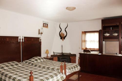 Giường trong phòng chung tại Quinta da Imaculada