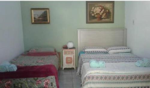 
A bed or beds in a room at Casa de Campo Charme da Serra da Bodoquena
