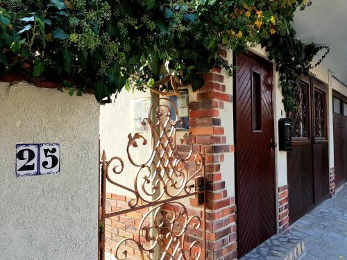 a building with a iron gate next to a door at Casa Vivaldi in Velingrad