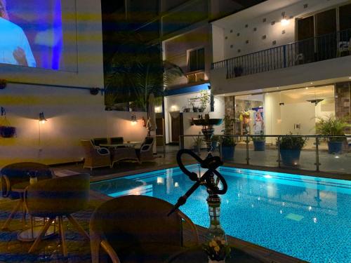 a swimming pool in a building with a hotel at فلل الخالدية in Jeddah