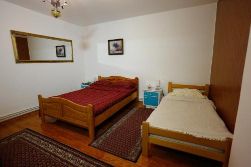 מיטה או מיטות בחדר ב-Apartman Carpe Diem