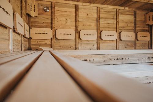 an empty room with wooden walls and ceilings at Appartements Wieshof in Sankt Johann im Pongau