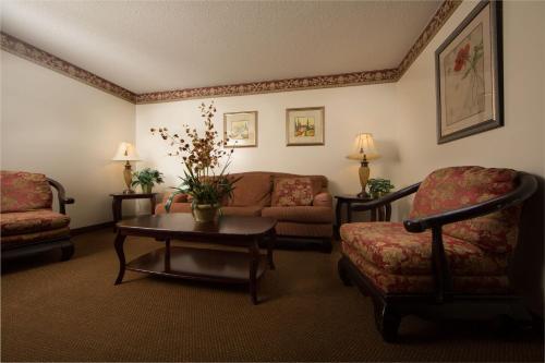 a living room with a couch and a table at Villa Roma Resort and Conference Center in Callicoon