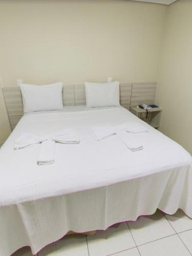 Ένα ή περισσότερα κρεβάτια σε δωμάτιο στο Maktub Hotel